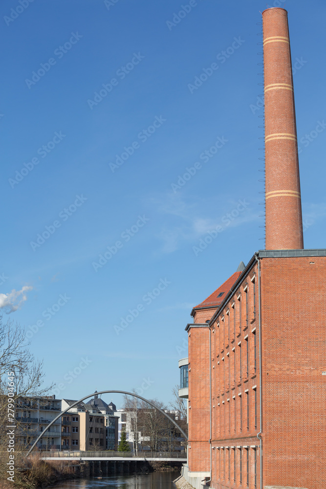 City old building with pipe and pedestrian bridge City old building with pipe and pedestrian bridge