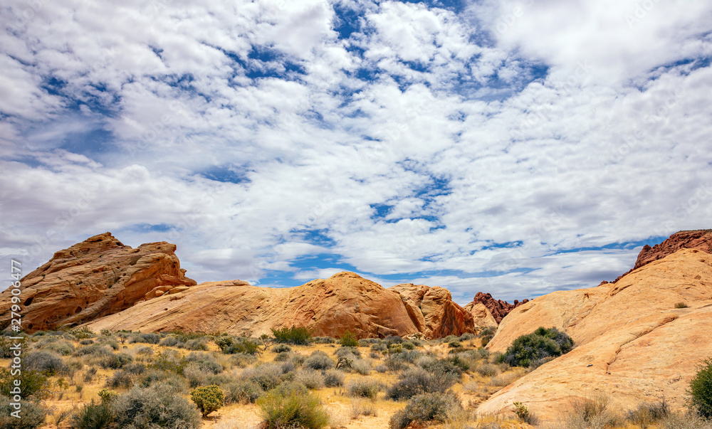 Fototapeta premium Valley of fire state park, Nevada USA. Red sandstone formations, blue sky with clouds