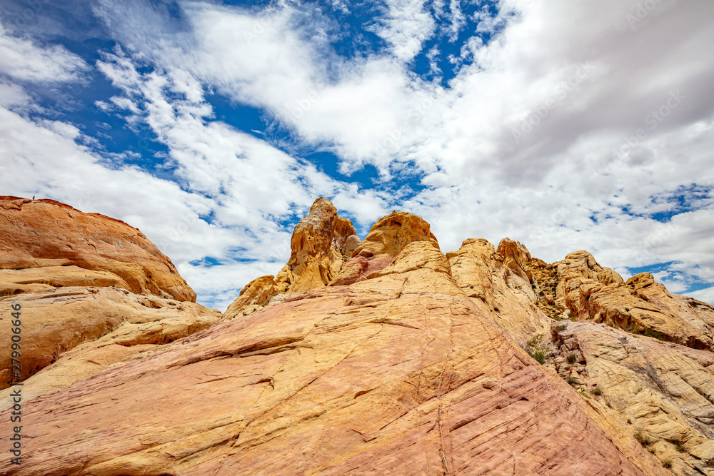 Fototapeta premium Valley of fire state park, Nevada USA. Red sandstone formations, blue sky with clouds