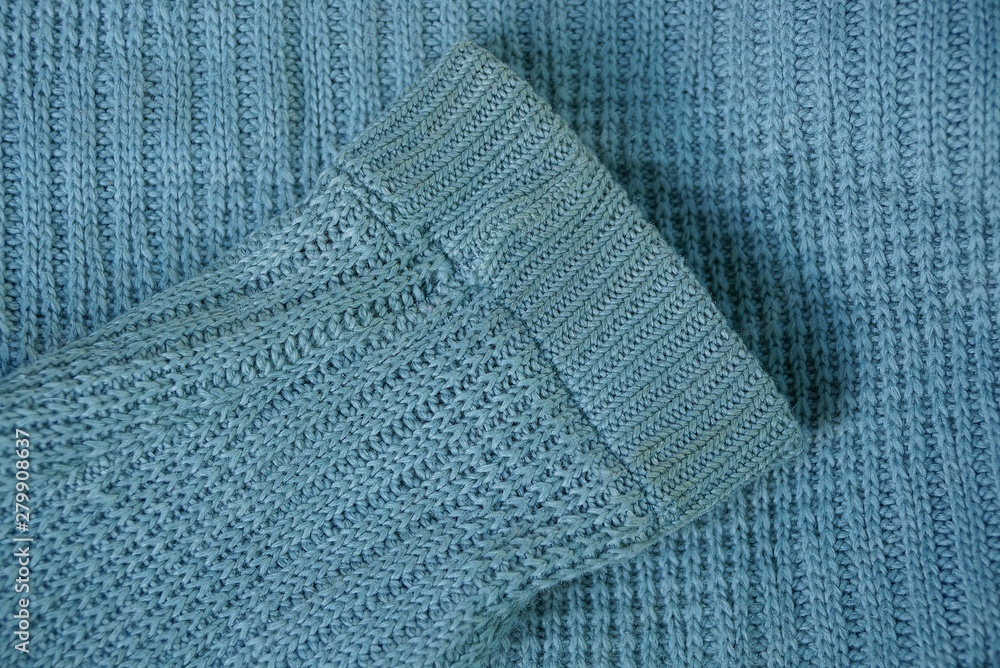 gray wool sleeve on a piece of old clothes gray wool sleeve on a piece of old clothes