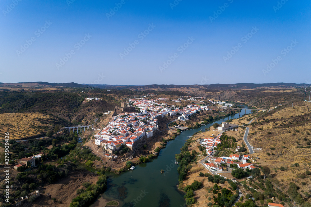 Aerial view of the beautiful village of Mértola in Alentejo, Portugal; Concept for travel in Portugal and Portuguese historical villages.