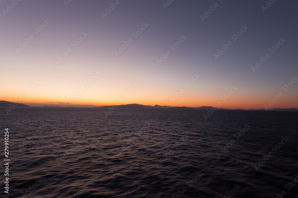 Obraz premium Sunset over the islands of the Aegean Sea