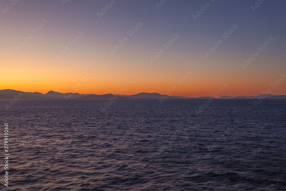 Sunset over islands of the Aegean Sea