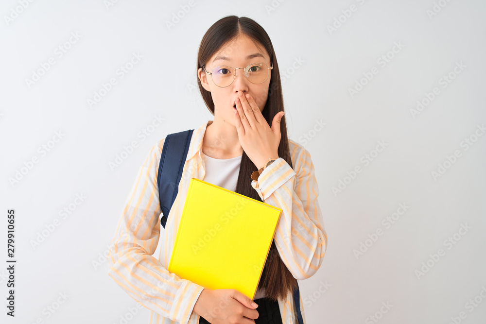 Chinese student woman wearing glasses backpack book over isolated white background cover mouth with hand shocked with shame for mistake, expression of fear, scared in silence, secret concept Chinese student woman wearing glasses backpack book over isolated white background cover mouth with hand shocked with shame for mistake, expression of fear, scared in silence, secret concept