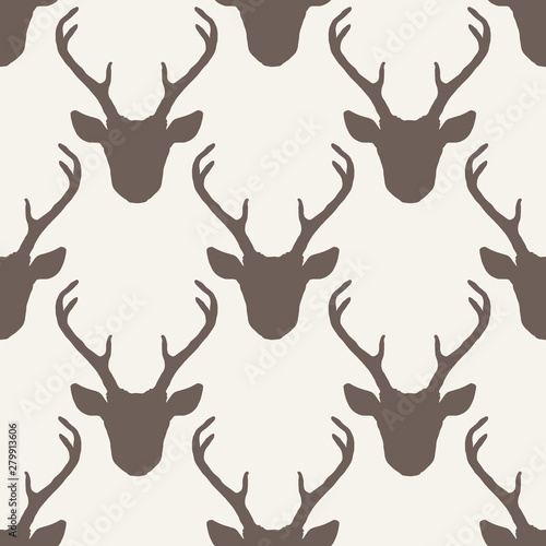 Seamless pattern with deer heads silhouettes