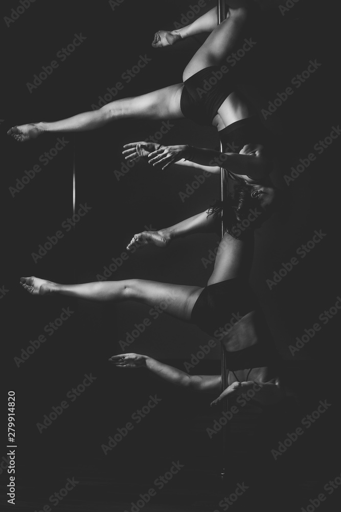 silhouette of two pole dancer women in action.