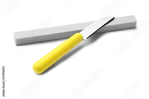 Sharp paring knife with grindstone isolated on white