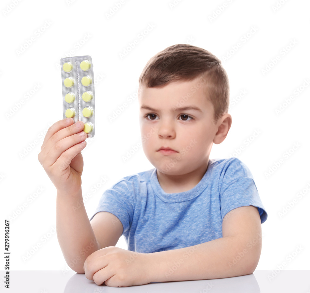 Little child with pills on white background. Household danger Little child with pills on white background. Household danger