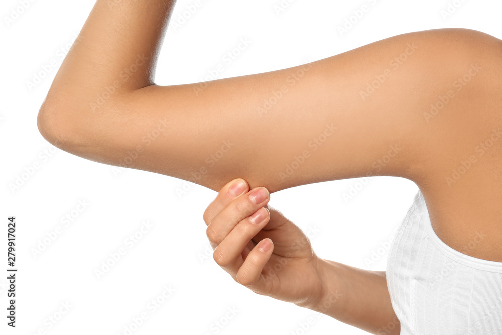 Young woman drawing attention to arm on white background, closeup. Plastic surgery concept Young woman drawing attention to arm on white background, closeup. Plastic surgery concept
