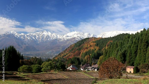 Clouds flowing over mountains in autumn scenery photo