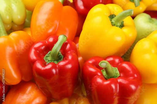 Fresh ripe colorful bell peppers as background, closeup