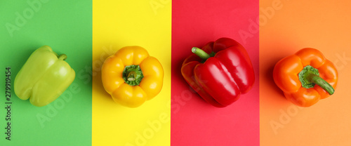 Flat lay composition with ripe bell peppers on color background photo