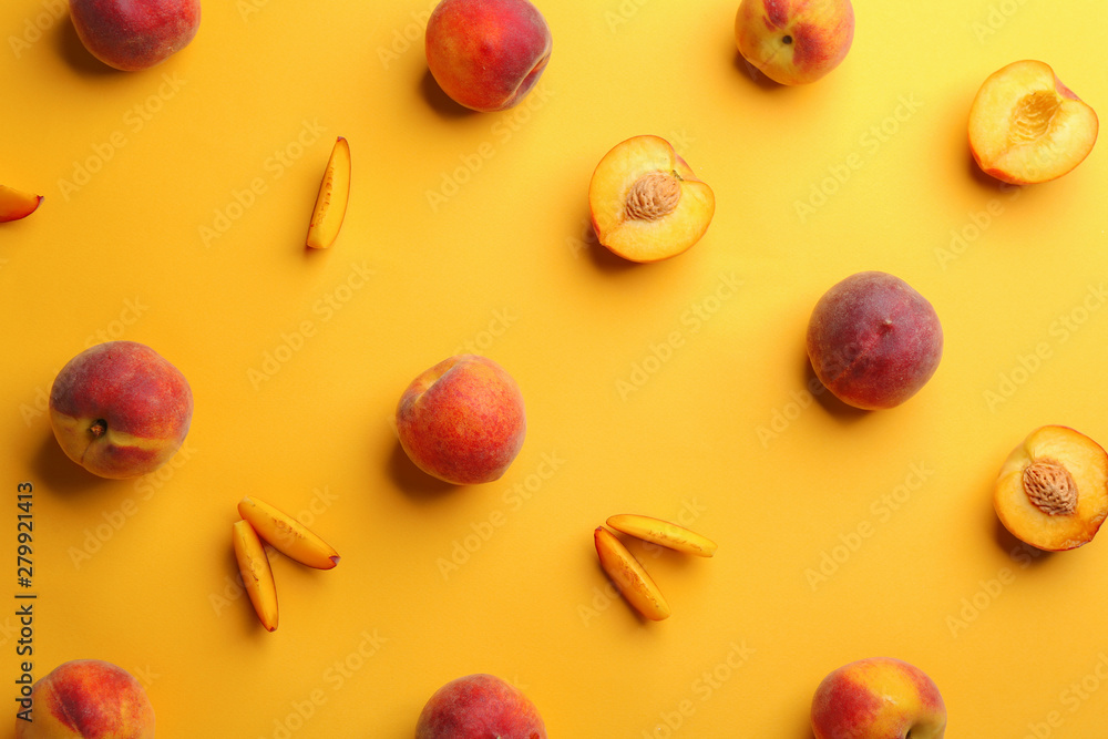 Flat lay composition with fresh peaches on yellow background