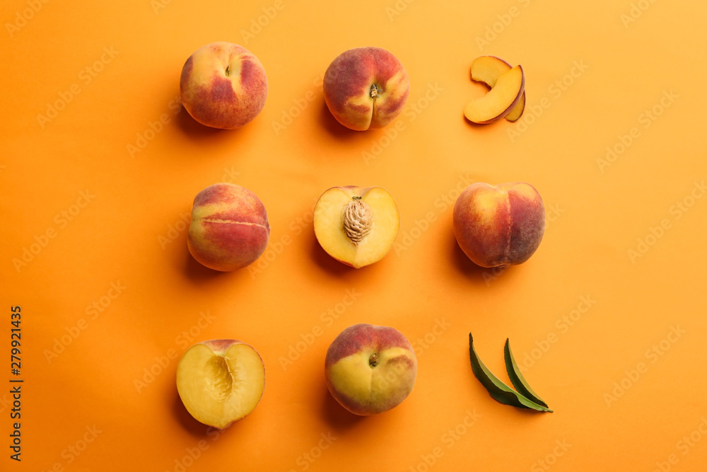 Flat lay composition with fresh peaches on orange background Flat lay composition with fresh peaches on orange background