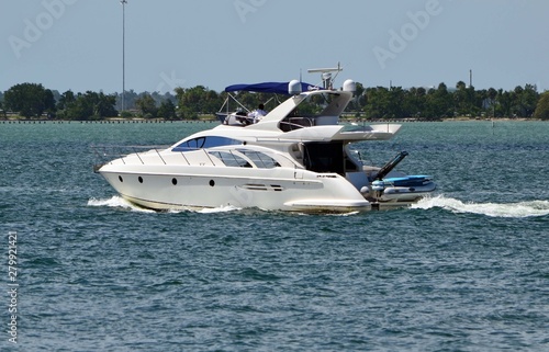 Upscale cabin cruiser on the Florida Intra-Coastal Waterway off Miami Beach.