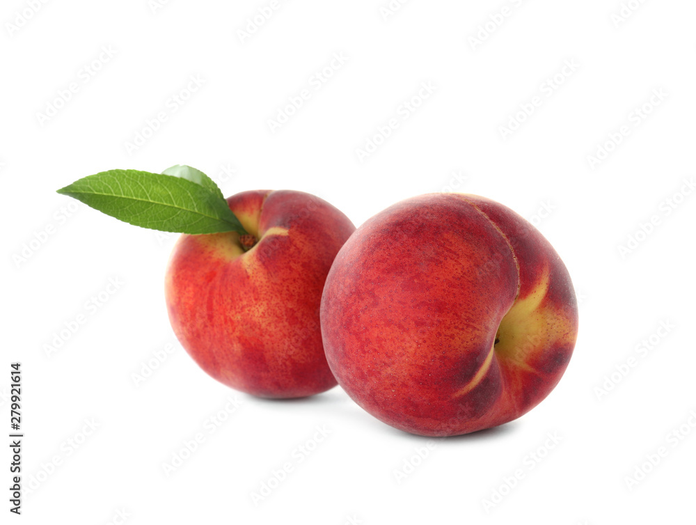 Delicious ripe peaches with leaf isolated on white Delicious ripe peaches with leaf isolated on white