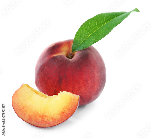 Sweet juicy peaches with leaf on white background