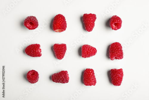 Composition with delicious ripe raspberries on white background  top view
