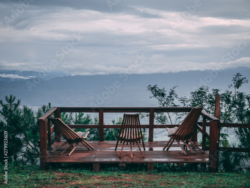 Deck with chairs in a mountain summit with a beautiful background © Kenny