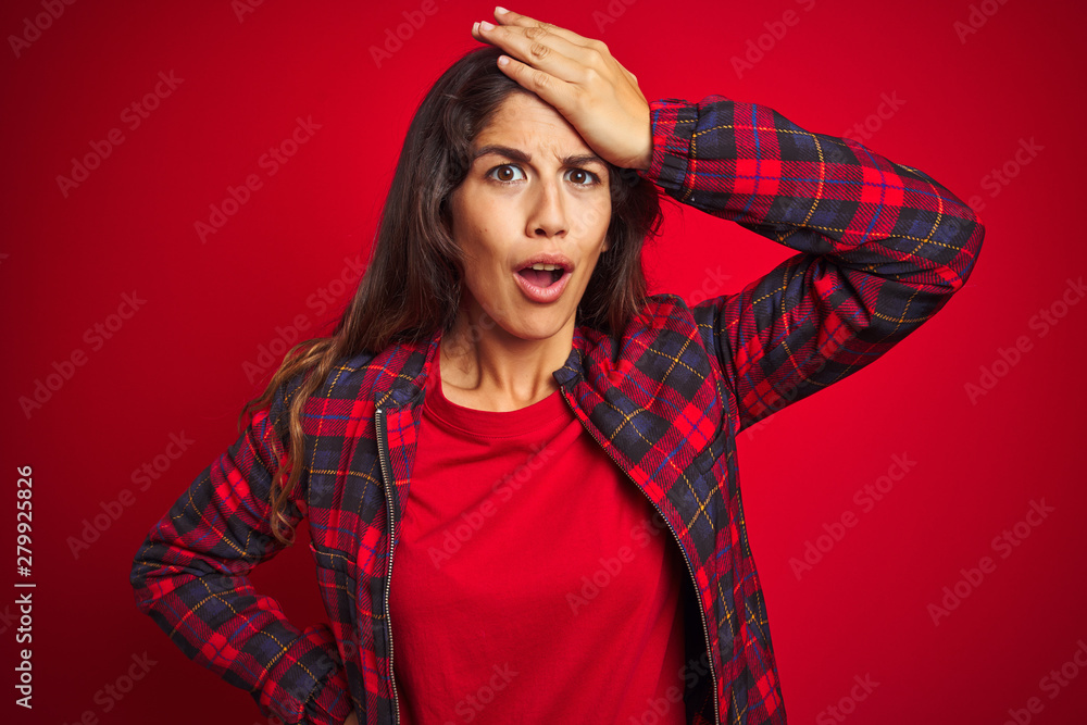 Young beautiful woman wearing casual jacket standing over red isolated background Pointing down looking sad and upset, indicating direction with fingers, unhappy and depressed. Young beautiful woman wearing casual jacket standing over red isolated background Pointing down looking sad and upset, indicating direction with fingers, unhappy and depressed.