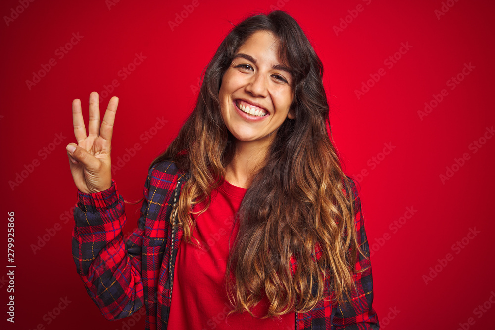 Young beautiful woman wearing casual jacket standing over red isolated background smiling making frame with hands and fingers with happy face. Creativity and photography concept. Young beautiful woman wearing casual jacket standing over red isolated background smiling making frame with hands and fingers with happy face. Creativity and photography concept.