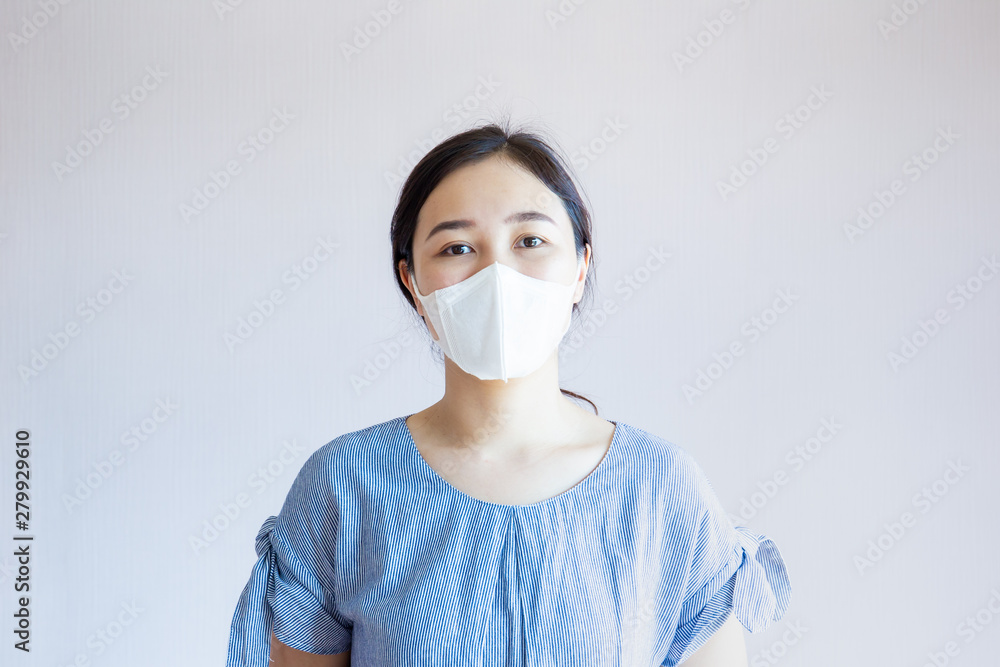 Sick woman masked with protective hygiene mask close up. Concept of pollution in the city and bad air quality. Sick woman masked with protective hygiene mask close up. Concept of pollution in the city and bad air quality.