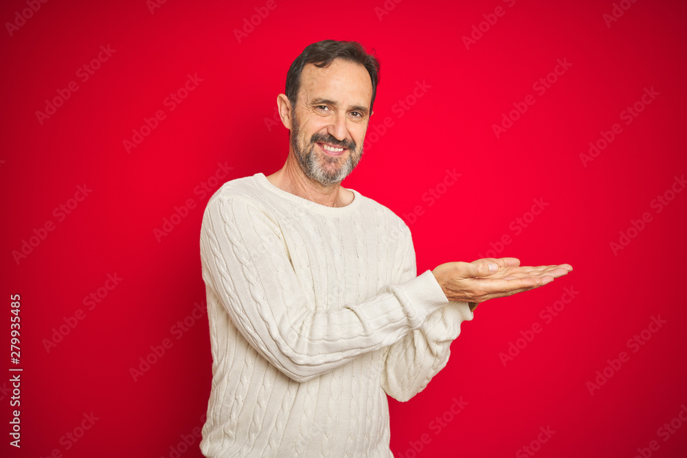 Handsome middle age senior man with grey hair over isolated red background pointing aside with hands open palms showing copy space, presenting advertisement smiling excited happy Handsome middle age senior man with grey hair over isolated red background pointing aside with hands open palms showing copy space, presenting advertisement smiling excited happy