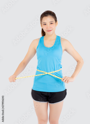 Beautiful slim young asian woman measuring tape thin waist wear uniform fitness isolated white background, asia girl loss weight for diet with exercise and workout wellbeing and healthy care body.