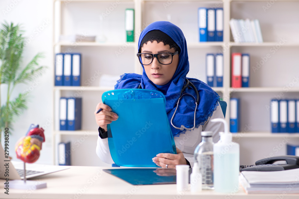 Female doctor in hijab working in the hospital Female doctor in hijab working in the hospital