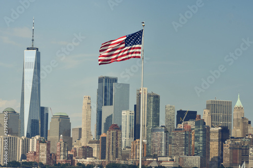 new york city skyline and american flag