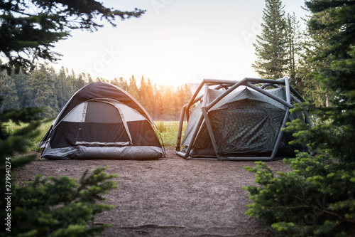 Two modern tents on campsite in Yellowstone National park at sunset time