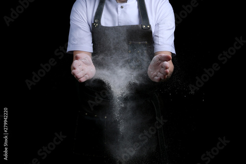 hand clap of chef with flour on black background isolated