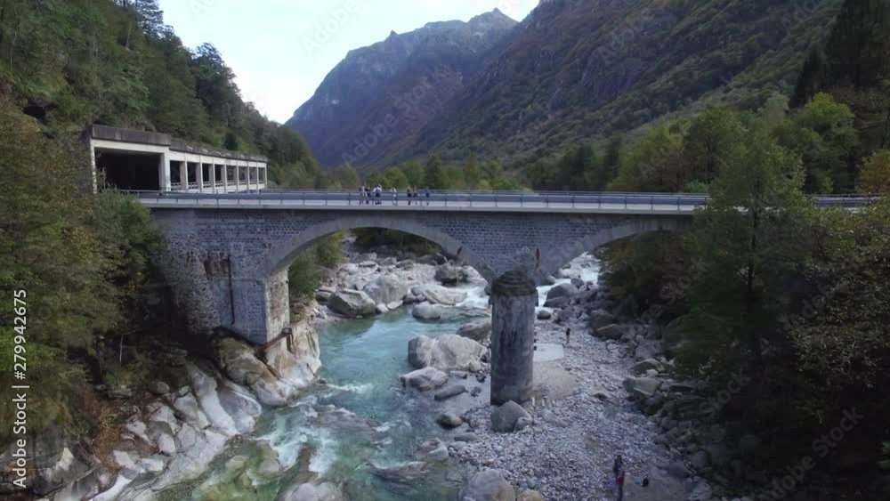 aerial view of Crystal clear turquoise mountain river Verzasca valley in Swiss alps. Bridge over the River aerial view of Crystal clear turquoise mountain river Verzasca valley in Swiss alps. Bridge over the River