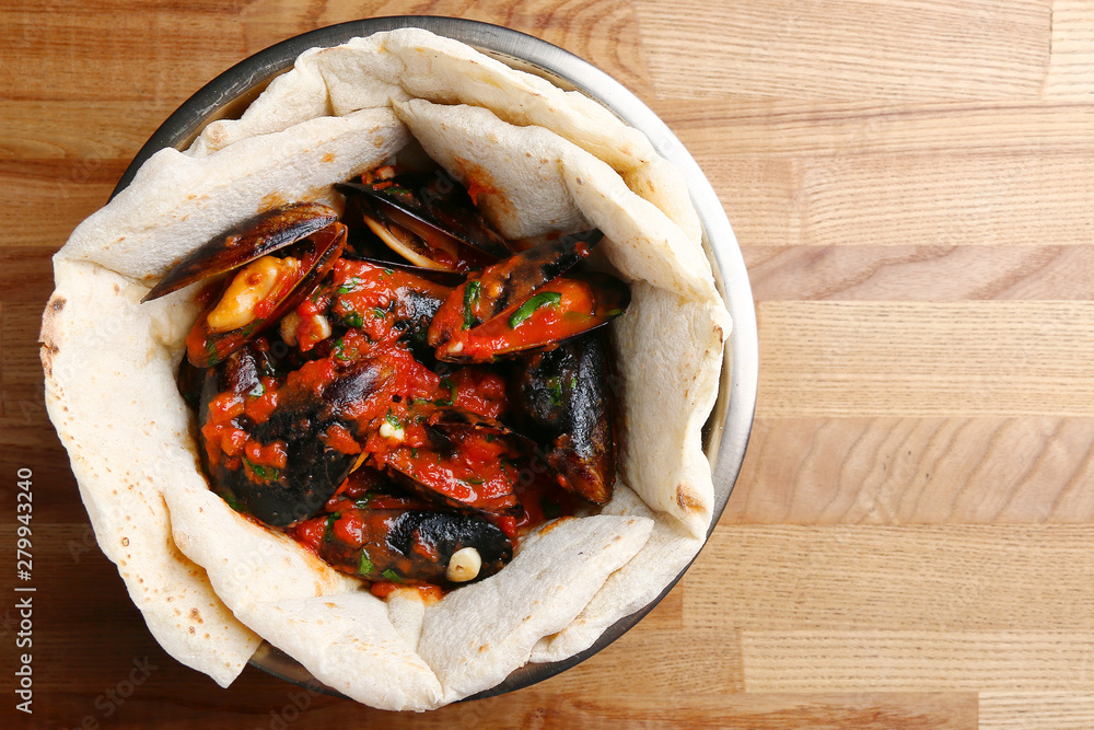 pizza with mussels on table restaurant traditional pizza with basil leaf pizza with mussels on table restaurant traditional pizza with basil leaf
