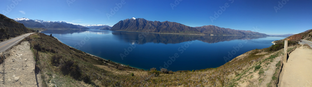 Snow capped Southern Alps overlooking beautiful lake scenes in the South Island New Zealand