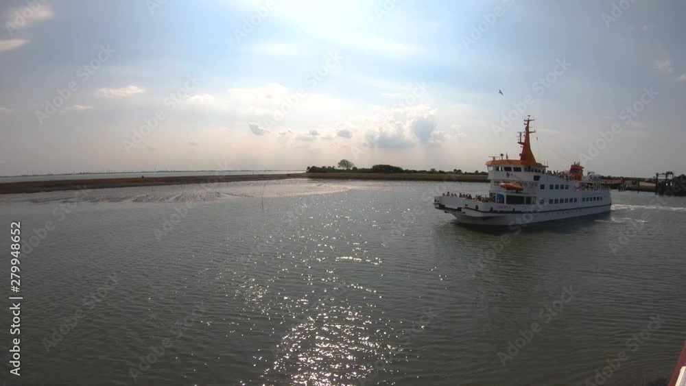 Langeoog Ship full of people going on the sea Langeoog Ship full of people going on the sea