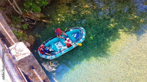 rafting boats and athletes in  river Voidomatis just before begin the voyage greece