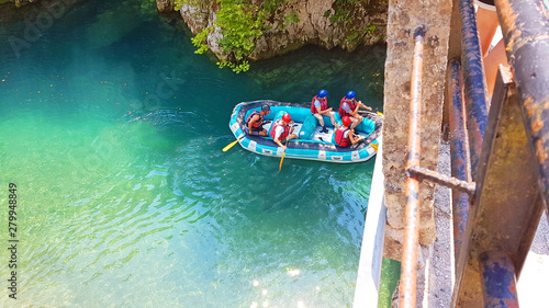 rafting boats and athletes in  river Voidomatis just before begin the voyage greece