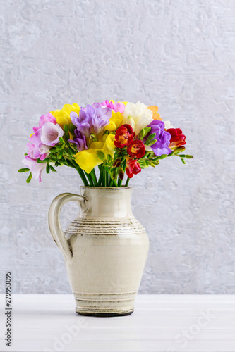 Wallpaper Mural Bouquet of colorful freesia flowers in ceramic vase Torontodigital.ca