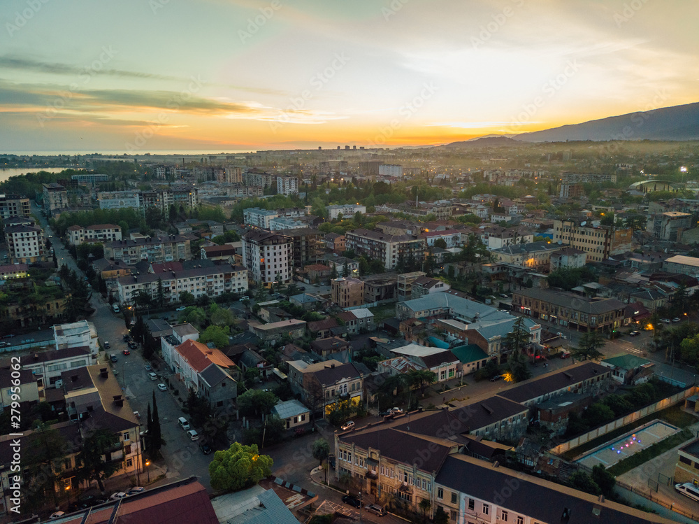 Fototapeta premium Evening resort town Sukhum, Abkhazia aerial view from drone