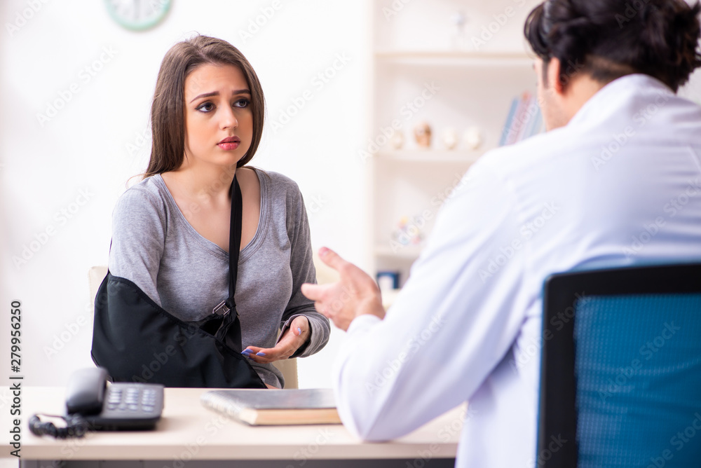 Young male doctor and female beautiful patient Young male doctor and female beautiful patient