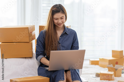 SME entrepreneur of Young Asian women working with laptop for Online shopping at home,Cheerful and Happy with box for packaging in home,Own Business Start up for Business Online and Online shopping