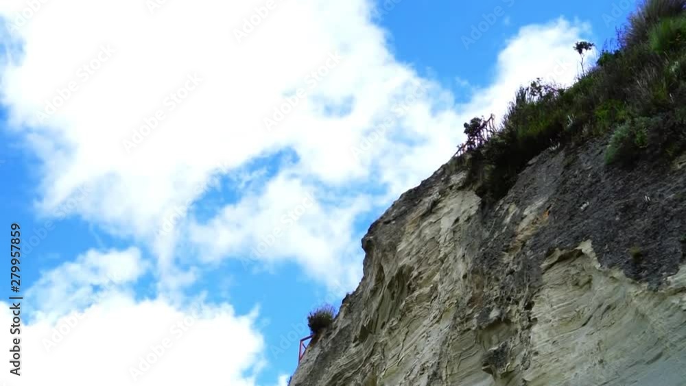 A windy day with clouds rushing past the cliff top A windy day with clouds rushing past the cliff top