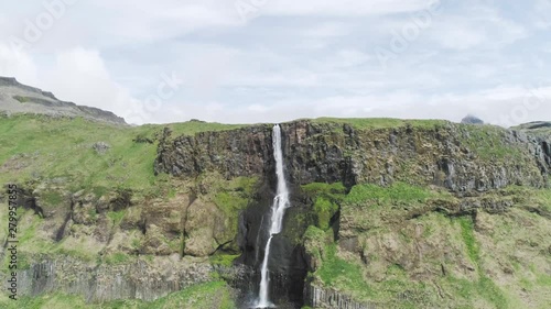 Wallpaper Mural Majestic 4K aerial of the famous and scenic tourist attraction Bjarnarfoss waterfall with its high and steep green cliffs in western Iceland. Torontodigital.ca