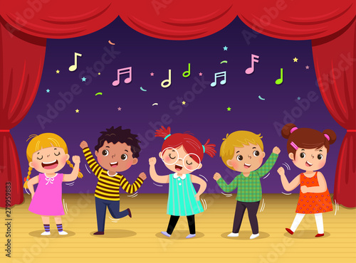 Group of kids dancing and singing a song on the stage. Children’s performance.