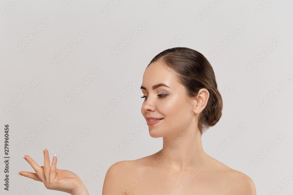 Woman surprise showing product .Beautiful girl expressive pointing to the side. Presenting your advertisement. Expressive facial expressions Woman surprise showing product .Beautiful girl expressive pointing to the side. Presenting your advertisement. Expressive facial expressions
