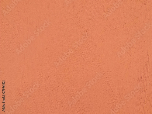 Textured plaster in coral . Background or texture seamless pattern