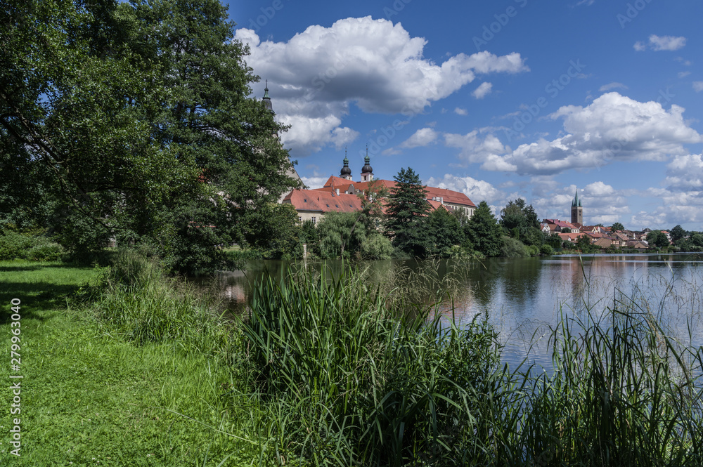 UNESCO protected Czech city Telc city scape on the castle with water reflection UNESCO protected Czech city Telc city scape on the castle with water reflection