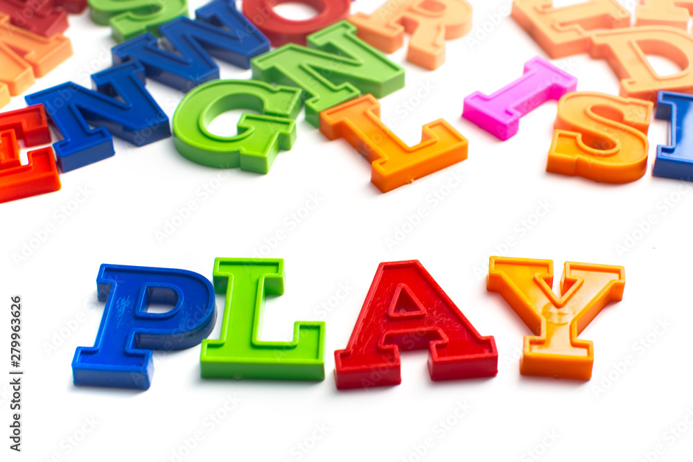 Heap of plastic colored alphabet letters close up. PLay Heap of plastic colored alphabet letters close up. PLay