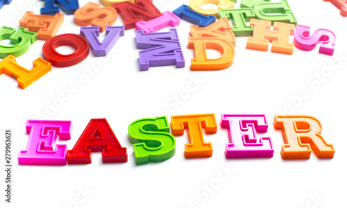 Heap of plastic colored alphabet letters close up. Easter